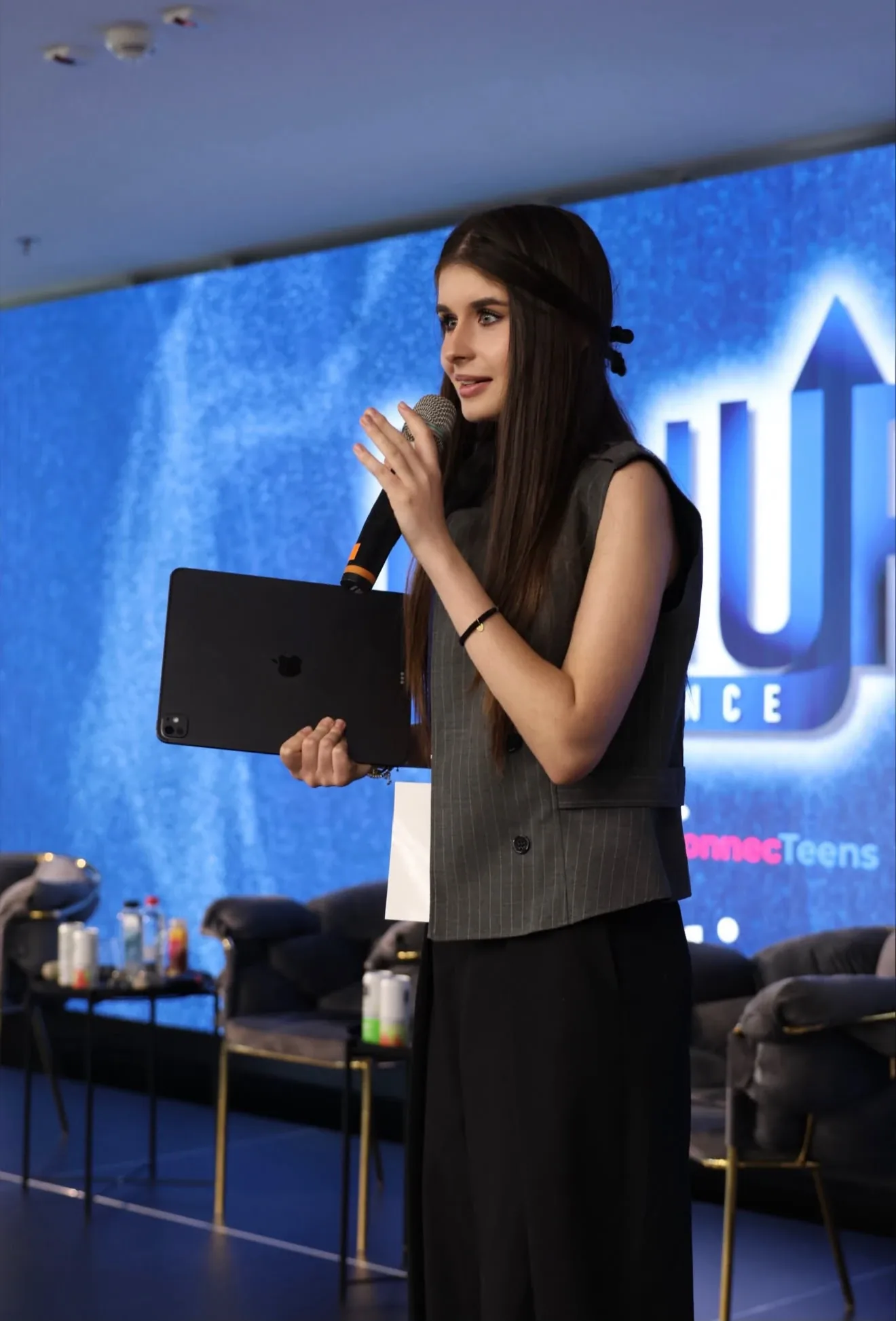 Sophia speaking on stage at the LeadUP conference